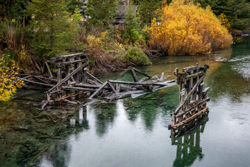 View of the remains of the old wooden bridge that crossed the Ruca Malén River on the section of Route 40 that makes up the Camino de los Siete Lagos, in the province of Neuquén, Argentina.