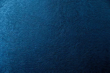  The surface of the black leather is Dark shaded by blue light.  Embossed pattern for luxury decoration or input text. © panumas