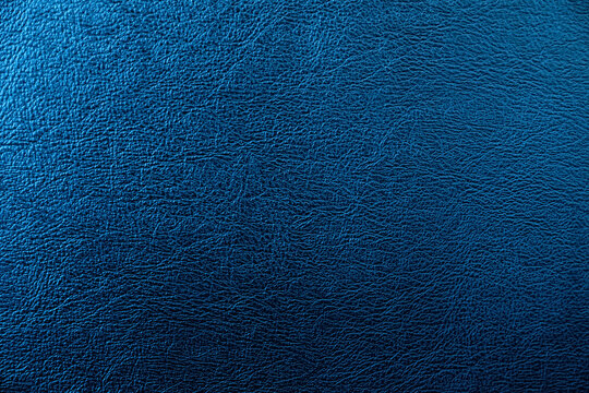 The Surface Of The Black Leather Is Dark Shaded By Blue Light.  Embossed Pattern For Luxury Decoration Or Input Text.