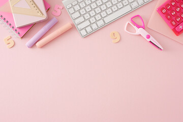Embrace technology as a tool for education. Top view shot of assorted stationery, calculator, white keyboard, colorful numbers on pastel pink background with empty space for promo or text