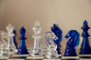 Transparent chess on a chessboard , chess game and hobby