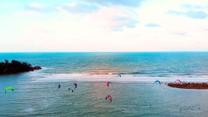 Approaching frame of kiteboarding in ocean. Aerial view, kitesurfing freestyle at hot sunny day....