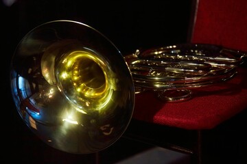 A musical instrument is a trumpet on a musician's chair. Before a concert or orchestra rehearsal