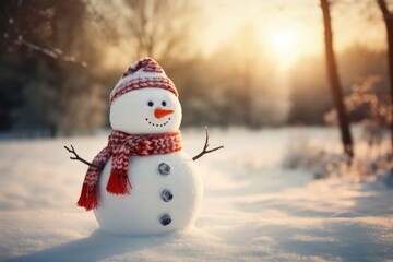 Obraz premium Christmas snowman in a snowy landscape.