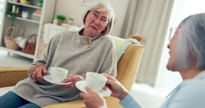 Senior women friends, tea and chat in living room for laugh, gossip or relax on chair in retirement. Elderly lady, conversation and together with coffee cup, funny story or comic joke in nursing home