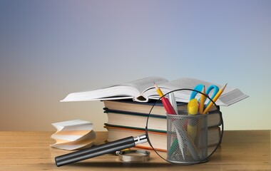 Magnifying glass with books for reading and searching information
