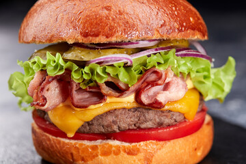 tasty burger with beef cutlet and vegetables