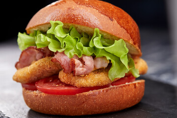 tasty burger with beef cutlet and vegetables