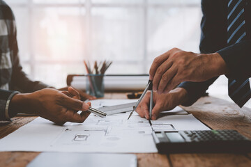Structural engineer team discussing and calculating work Office design of the building structure...