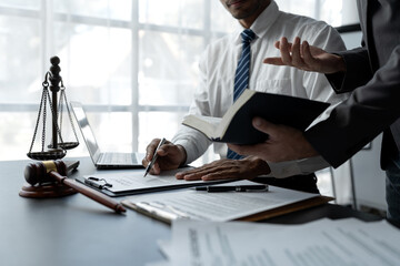 Businessmen or lawyers working together at a meeting, teamwork and partnerships, discuss documents,...