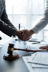 The handshake after a good cooperation, consulting between attorney and client, businessman, tax and real estate project company. - obrazy, fototapety, plakaty