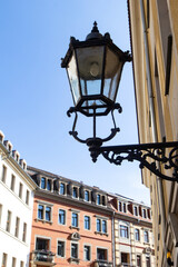 Fototapeta na wymiar View of a beautiful street lamp against a blue sky. City landscape, vertical view