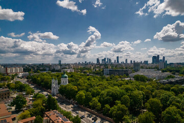 Fototapeta premium Drone, Warsaw city, sky, clouds, green, landscape, buildings, urban design, traffic, park, view, summer, blue