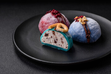 Delicious sweet colorful mochi desserts or ice cream with rice dough and toppings