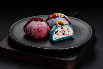 Delicious sweet colorful mochi desserts or ice cream with rice dough and toppings