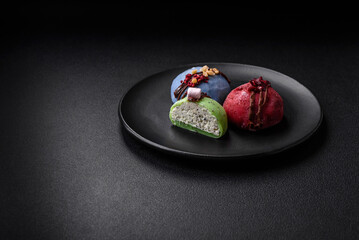 Delicious sweet colorful mochi desserts or ice cream with rice dough and toppings