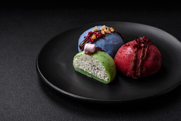 Delicious sweet colorful mochi desserts or ice cream with rice dough and toppings