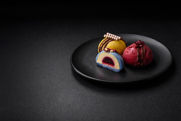 Delicious sweet colorful mochi desserts or ice cream with rice dough and toppings