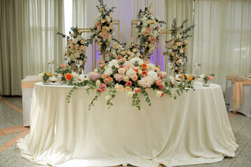 Wedding table with favors and flowers. Elegance wedding decor.