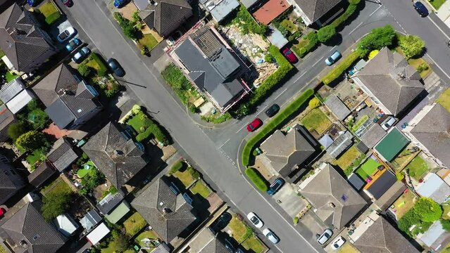 AAerial footage of the town of Bingley in the metropolitan borough of the City of Bradford, West Yorkshire, England, showing the British housing estates and rows of houses in the summer time