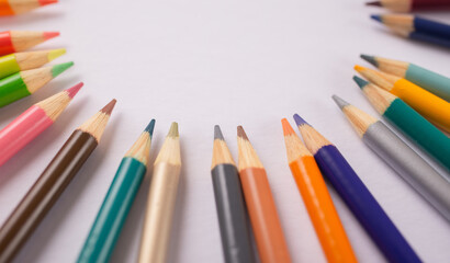 colored pencils in a circular design artwork 