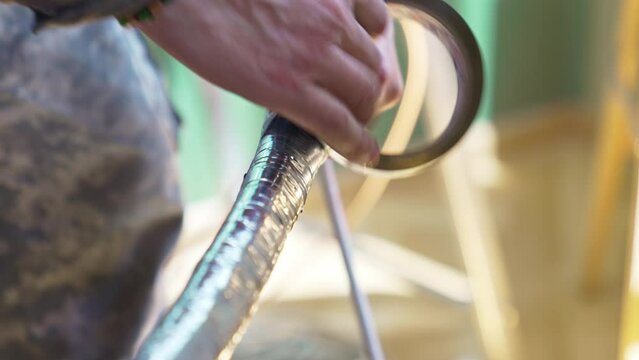 Twisting the tubes and wire the route of split system with foil adhesive tape.