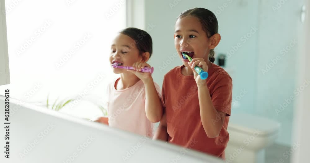 Wall mural Learning, home or children in bathroom brushing teeth together in a grooming morning routine. Kids, oral care or girls cleaning mouth with toothbrush for dental health, growth or child development