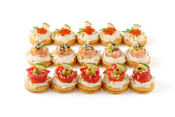 canape with salmon shrimp and avocado red caviar on a white background for a restaurant website