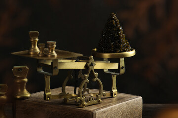 Black caviar is on scales. Black caviar. A delicacy of sturgeon fish. Brass antique scales. A...