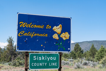 Welcome to California sign along highway 97 in Northern California in Siskiyou County. - 628296403