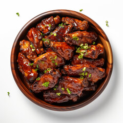 Top-down view of a bowl of barbecue ribs isolated on a white background