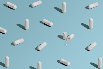 Vitamin pills on background
