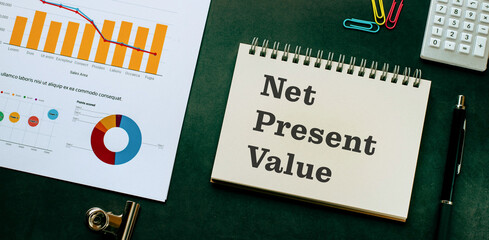 There is notebook with the word Net Present Value. It is as an eye-catching image.