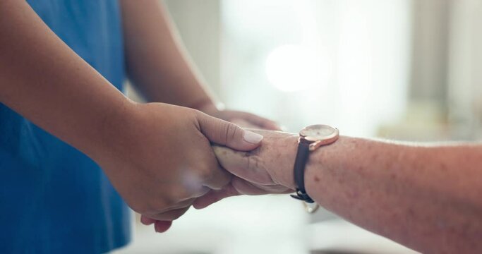 Nurse, holding hands and senior patient with gratitude and caregiver support in retirement home with empathy. Elderly person, healthcare and doctor with kindness, helping and hope in a clinic