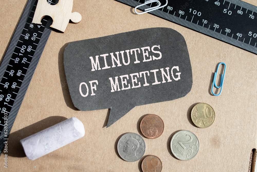 Poster minutes of the meeting text on a paper on the colorful paper background