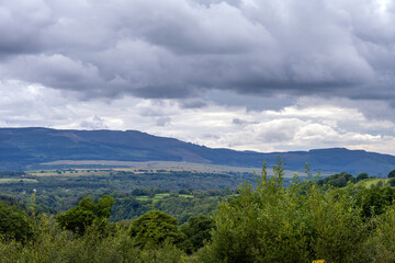 Walking in the Brecon Beacon or Bannau Brycheiniog national park, Powys, Wales, on a cloudy summer afternoon