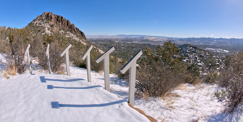 View from Picnic Hill along the Thumb Butte day use hiking trail in the Prescott National Forest just west of Prescott Arizona, covered in winter snow and ice.