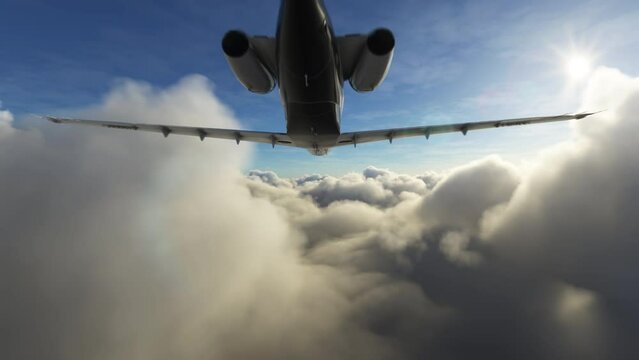Rear view of a private airplane flying above clouds. Aerial shot of a small jet plane during a flight between through layers of clouds during afternoon