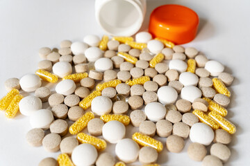 Different pills vitamins on the white table.  Medical, vitamins, health background