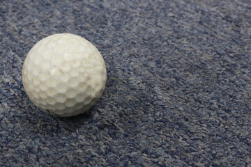 Photo of a white golf ball on the practice field