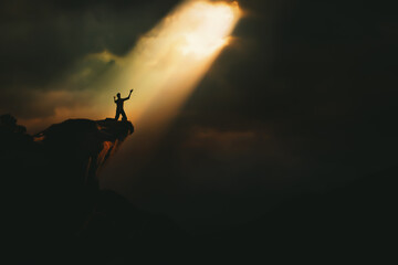 Christian praying to God and man shouting with arms raised to God, pain and trial and sorrow darkness and bright light and rays, hope and despair concept
 - obrazy, fototapety, plakaty