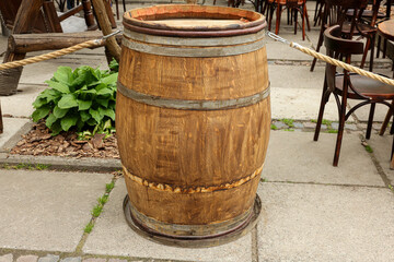Fototapeta premium Traditional wooden barrel on street outdoors. Wine making