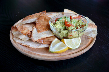 Nachos with Guacamole on Black Background