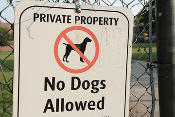 private property no dogs allowed sign in black writing on white background with a picture of a dog...