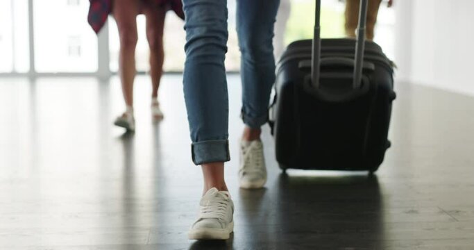 Woman, airport walking and suitcase with feet and luggage going on holiday and closeup travel. Journey, flight and female person shoes with traveling bag and trip in boarding terminal with passenger