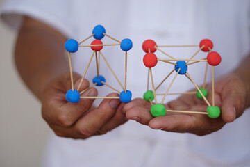 Close up scientific model teaching aid to teach about molecular structures, made from plasticine...
