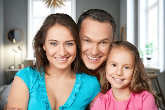 Home portrait of happy father, mother and child hug, AI generated image