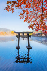 Yufuin, Japan - Nov 27 2022: Tenso-jinja shrine at lake Kinrin, is one of the representative sightseeing spots in the Yufuin area at the foot of Mount Yufu.