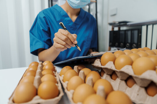 Lab test worker Quality control - Optimum Chicken Egg Quality, Practical Approach poultry eggs to accurately and consistently measure the quality of their produce.