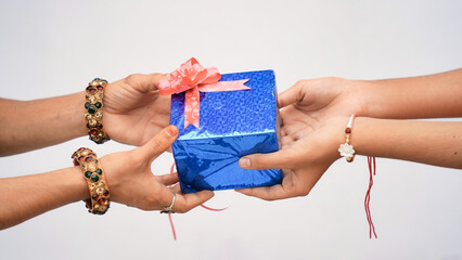 Raksha Bandhan concept, Indian brother giving gift to his sister